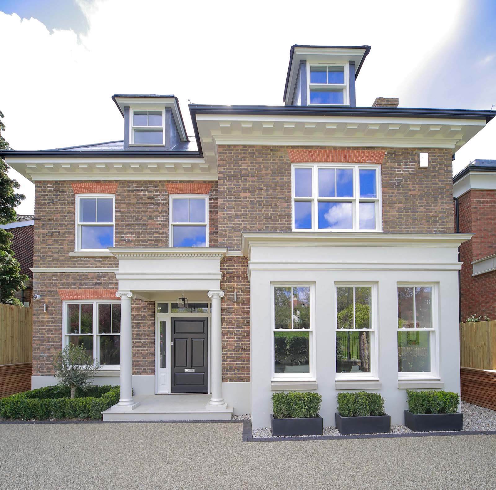 Wooden sash spring balance windows on London home