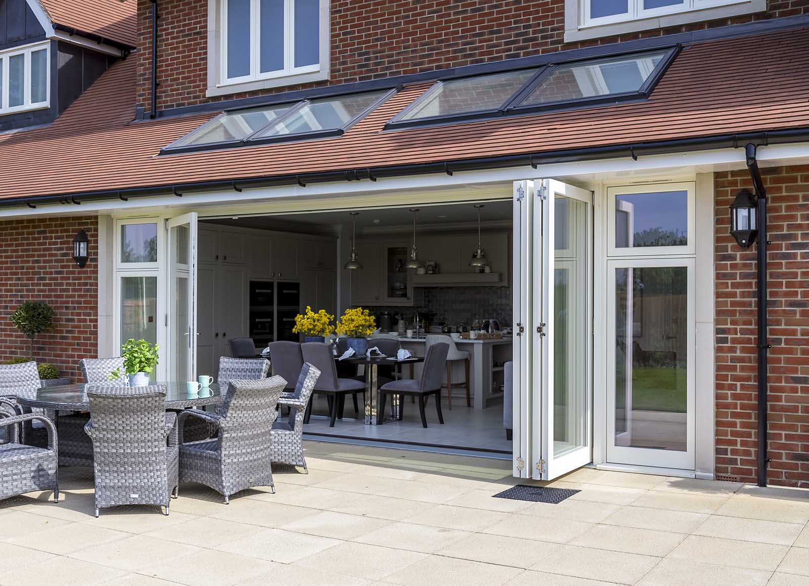 White wooden bi-fold doors