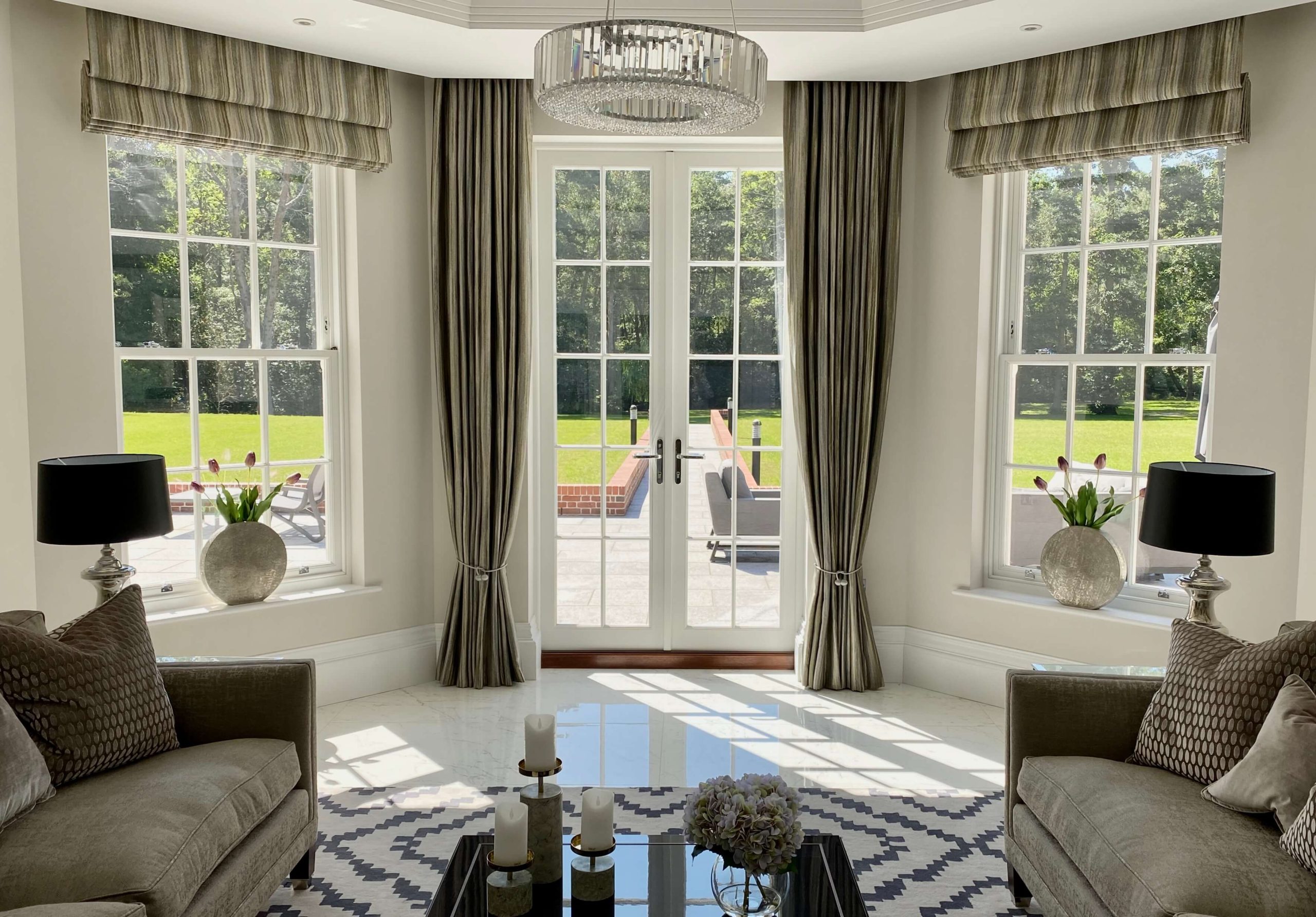 Living room with white timber french doors and white timber sliding sash windows