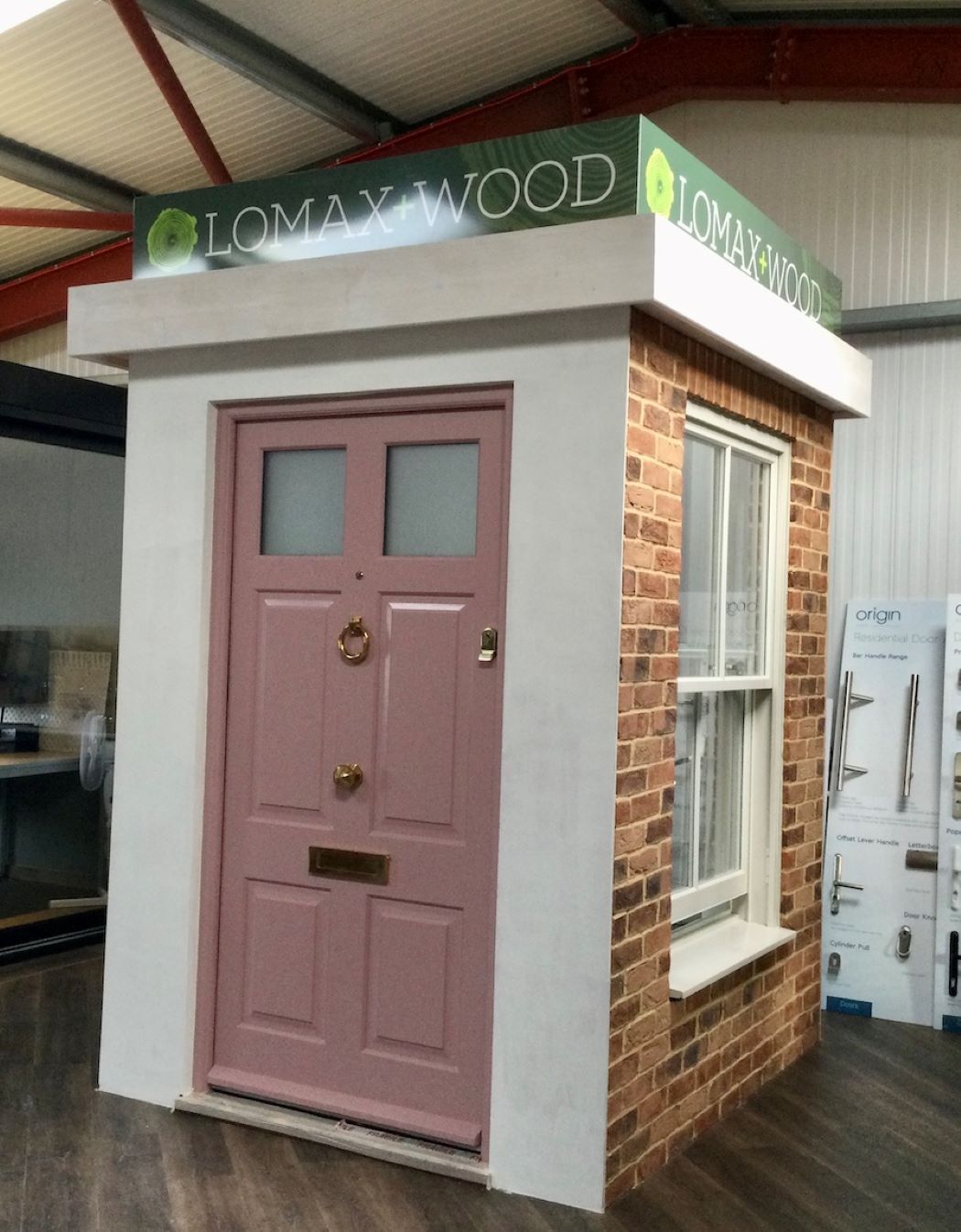 pink timber front door on display in lomax + wood Kent showroom