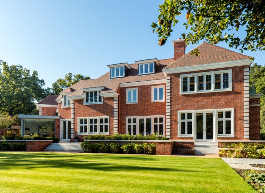 large house featuring Lomax + Wood made-to-order timber casement windows and French doors